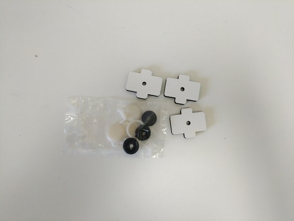 Locate the bag of foot hardware and (3) laser cut foot mount pieces.