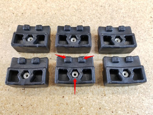 Insert stainless steel nylon lock-nuts into the side with circular marks.