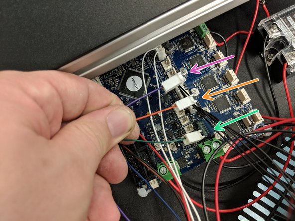 The green, orange, and purple wires exiting the X tower bundle connect to the locations shown in the photos.