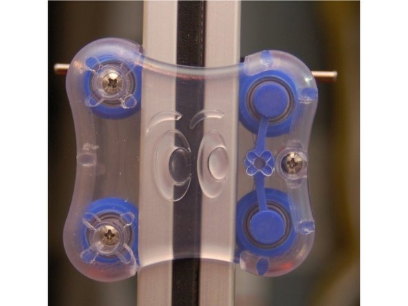 Set the outer carriage half against the inner carriage half and fix in place using three #4, 1/2&quot; machine screws.