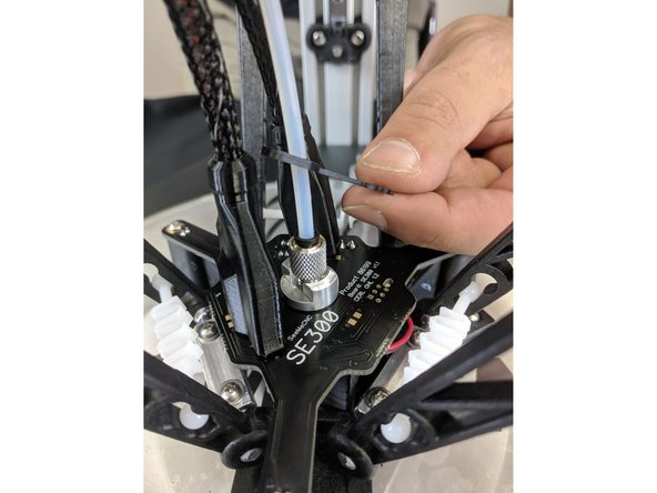 Slide a PTC clip onto the Bowden tube as shown.