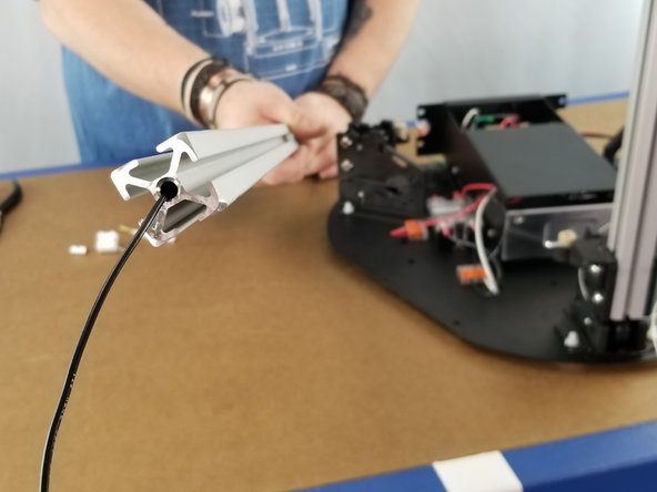 Feed the black wire coming from the Solid State Relay up the extrusion as you have done before and out the top of the extrusion as shown in Pics 1 and 2.
