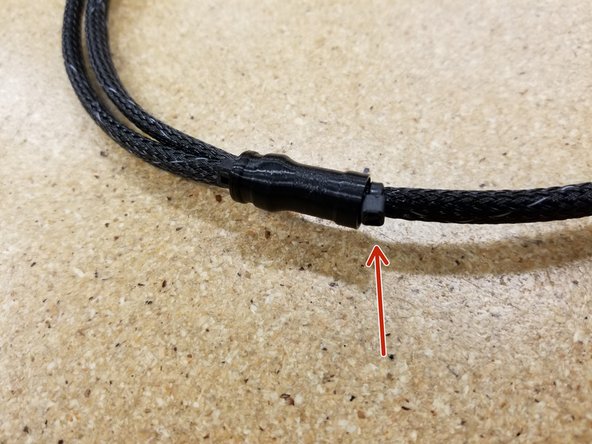 Add a zip tie to the mesh loom, just above the loom splitter, to secure it in place. See photo for reference.