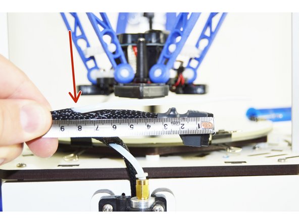 This is the entry point of the PTFE tube into the whip. You will need to compress the mesh loom at that point in order to separate it enough to get the PTFE enough room to gain access.