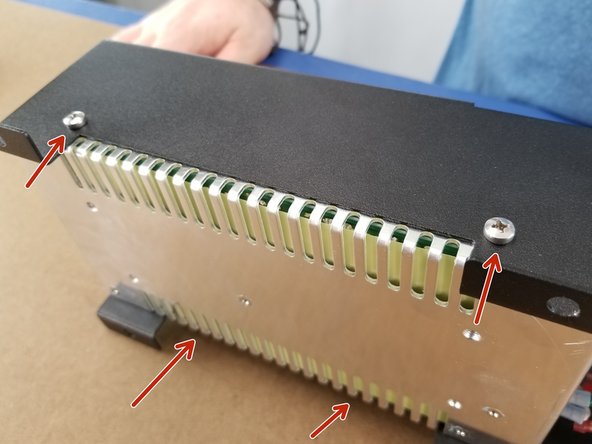 Secure the power supply to the bracket using the M4 x 5mm long screws through the bracket into the power supply.