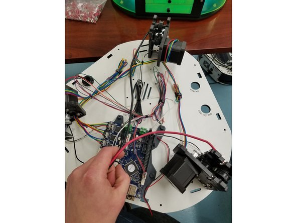 Now install the black 12awg wire from the Z tower, and the red 12awg wire from the Y tower in the locations indicated here.