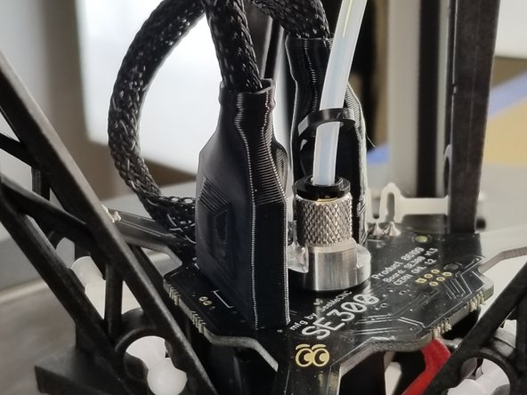 Slide the boot over the 10 pin connector to cover and protect the clip and harness as shown in Pic 2.