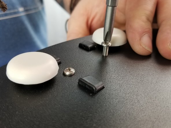 With the base still upside down on the brackets, insert and tighten the 6 screws between the feet into each bracket using a standard P2 phillips screw driver.