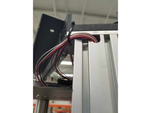 If you want, use an extra zip tie through the unused hole in the machine's frame to keep the wires clean and out of the way.