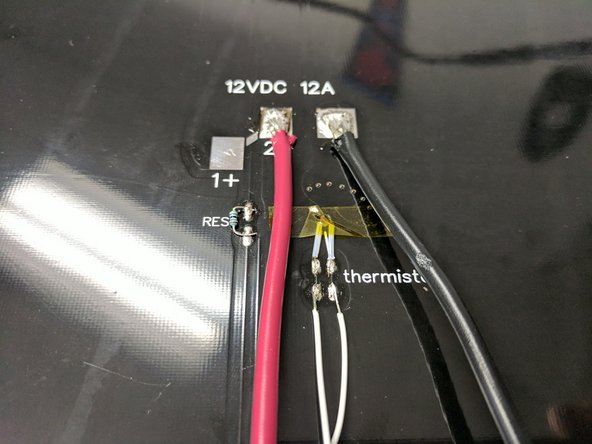 Solder the thermistor leads to the pads where indicated. There is not polarity so either wire on either pad will work. Since these pads are smaller, you want to be sure not to heat them too hot for too long or the pad can detach from the board.