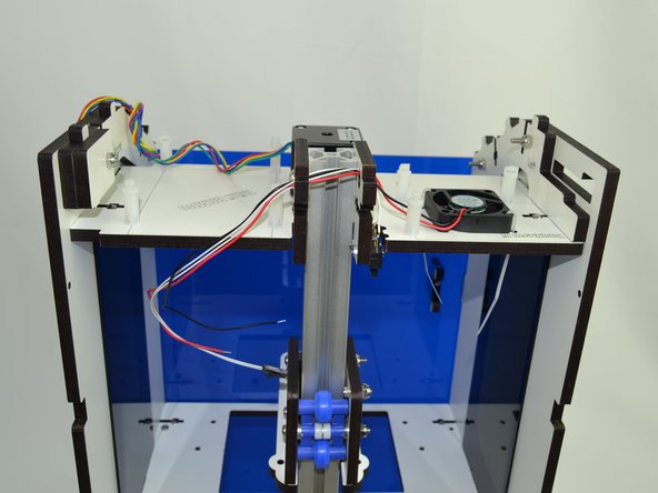 Route the fan and endstop wires through the holes located in the top corner of the Upper TSLOT Mounts.