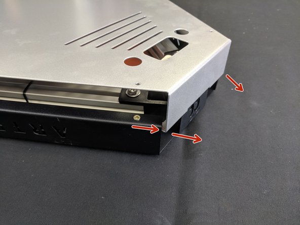 To remove the cover, lift it straight up on all three corners. You will then need to gently pull out on the silver sides (one corner at a time) to un-hook the cover.