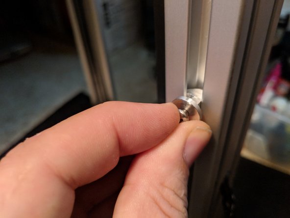 Rotate the hanger clockwise to lock it in the rail and tighten the screw as shown in Figure 2.