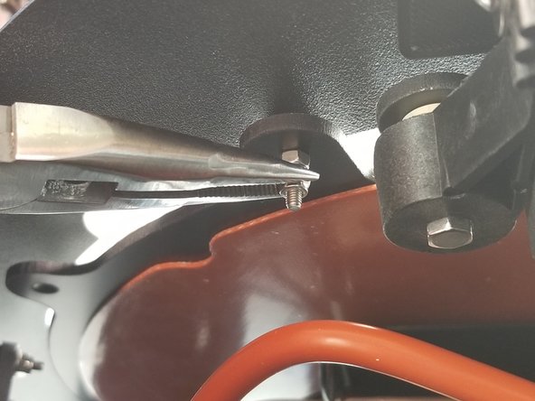 Do not over tighten this screw as you will still want to be able to rotate the build plate clamp.  Just snug is good