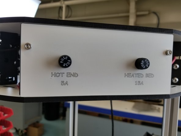 NOTE: If you purchased a machine after 8/22/2018 you will not need to install the 5A or 15A fuses. Connect the 20awg red wire from the hotend whip and the 12awg black wire from the tower directly to the green terminals indicated in the photo.