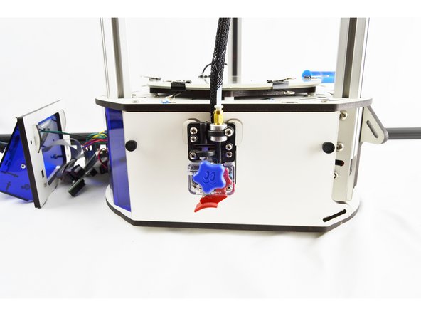 To remove the hotend whip you will first need to remove the side panel with the extruder. This panel is secured with (2) thumb screws.