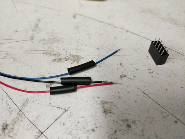 The first step is to locate the 10 Position 2X5 Connector. Then isolate the 26awg red, black, and blue wires from the whip. The ends of those wires will have connectors pre-installed. You will need to cut the connectors off of the wires.