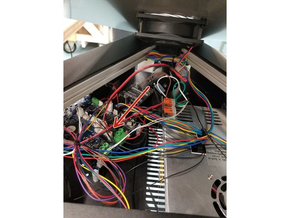 Plug the top cover fan connector back in to place and reinstall the top cover with the push rivets you removed in the beginning steps.