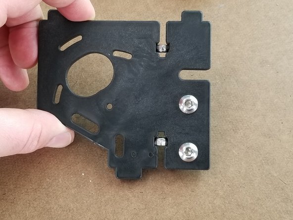 On three of the larger brackets, you will insert the bolts with T-nuts like in the previous step but these 2 will not have washers.