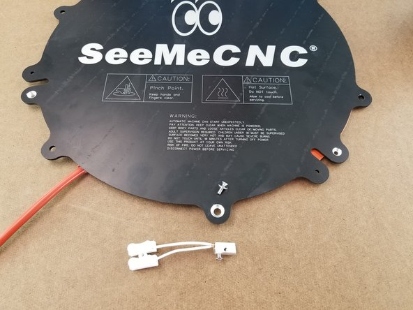 This step you will need the Heated bed with aluminum heat spreader, the remaining M3 x 10mm long flat head screw, #4 washer, and the thermistor setup you made in the previous step.