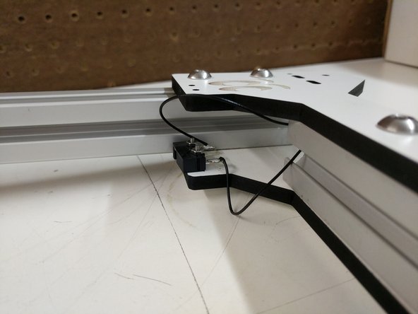 Solder the wires to the end-stop. Reminder: You should be soldering the wires to the outer legs of the end-stop.
