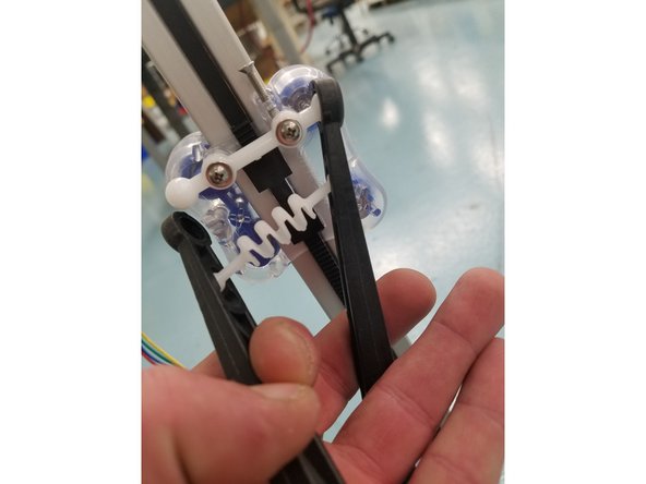 Repeat the same steps with the springs, arms, and acetyl ball joints attached  to your carriages.