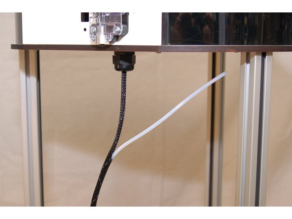 The Bowden tube is carried inside the mesh loom that holds the hot end wiring.