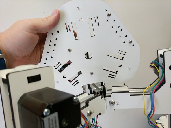 Locate (3) 1/4-20 button head screws, and (3) TSLOT nuts. You will use those to fasten the plate that you just attached the board mounts to.