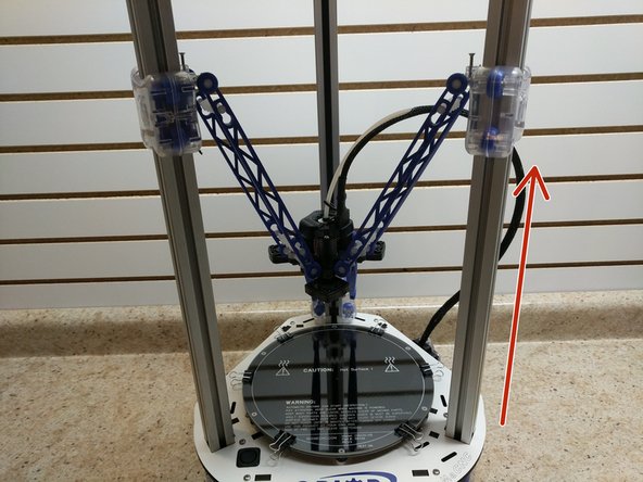 Slowly and carefully raise the carriages, one at a time until they are all three in printing position. Be sure to look at all three images before beginning.