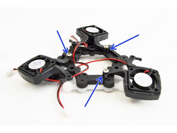 Secure one leg of each fan mount into the hole on the bottom of the ball joint platform.