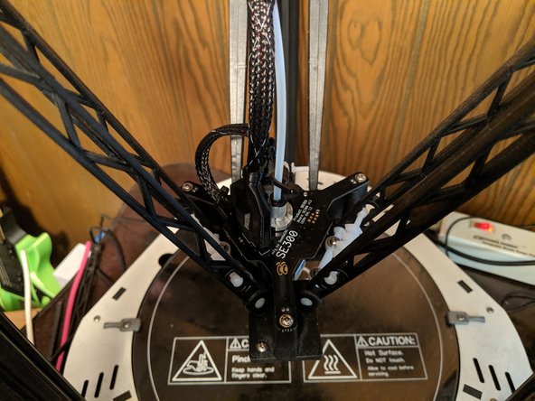 You can now re-connect the PTFE tube and arms in the reverse way you installed them at the beginning of the guide to finish the build.