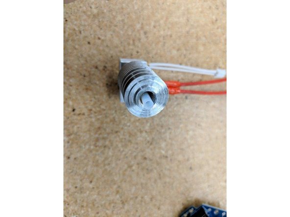 The Locking PTC Adapter has a PTFE tube in it.  Remove the tube from the adapter before you begin.