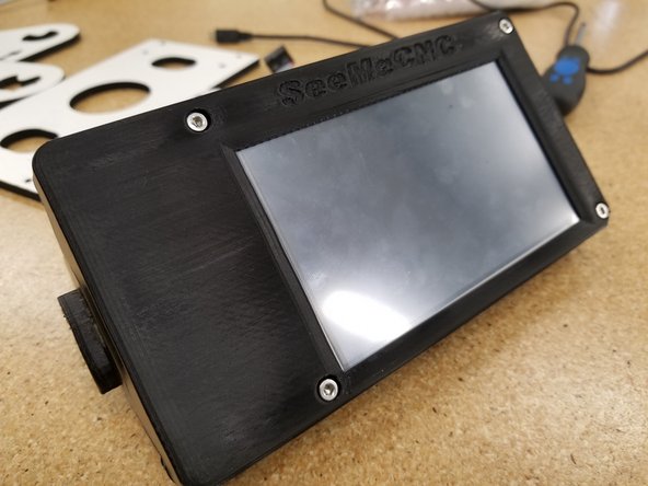 The bolts should pass through the holes on the PCB of the touch screen when  everything has been aligned properly.