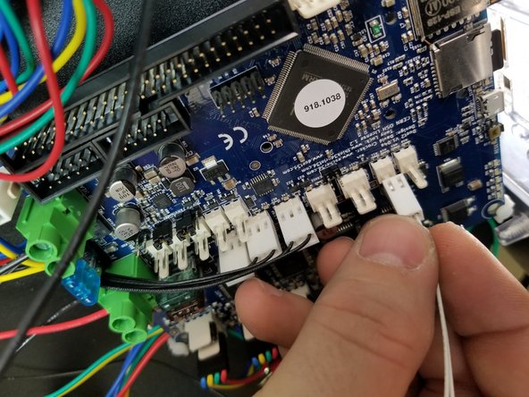 The thermistor plugs into the location on the duet that is the 2 pin plug in line with the endstop wires.  It goes to the 6th position from the inside of the machine lined up with the endstop wires.