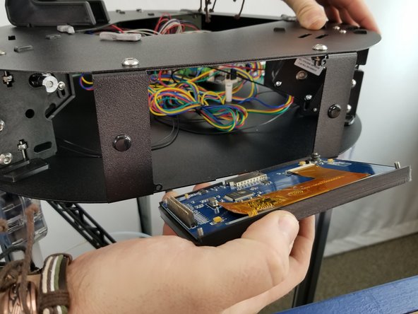 Inert the touch screen in the sheet metal panel on the front of your ptiner's top assembly, where you removed the acrylic panel earlier.