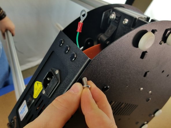 Insert one 1/4-20 x 1/2&quot; long button cap screw through the hole on the bottom under the power plug side of the sheet metal as shown in Pic 3.