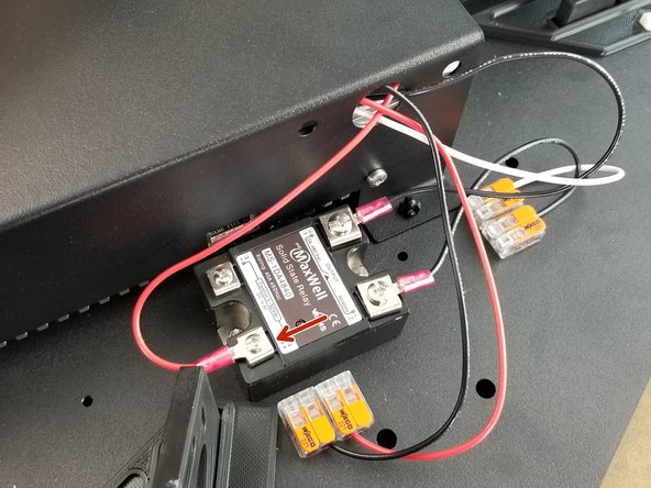 Secure the red ring terminal from the 400mm red wire to the solid state relay as shown in Pic 3.  The red wire goes to the terminal labeled with a + above it.