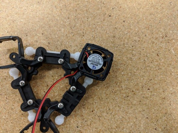 Install the other two layer fans, paying careful attention to their orientation (label away from the ball arm) and the wire route.