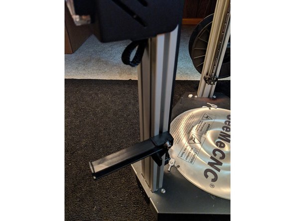 (2023) Use the same method as listed in step 7 for the updated quarter-turn fastener: pre-assemble, put in place, turn and pull to actuate, tighten.