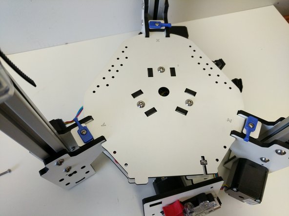 In this step and all other steps using the TSLOT nuts, the boss (ridge) on the nut should be facing away from the head of the button head screw.