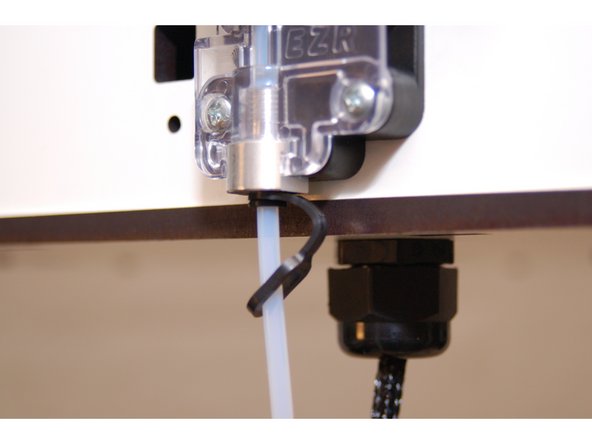 Slide a retainer clip onto the Bowden tube (Closed end)