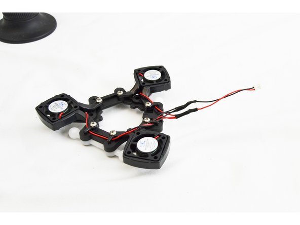 Slide the heat shrink tubing over the (2) spliced connections and apply heat, shrinking it onto the leads.