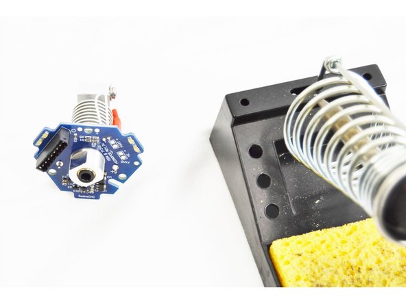 After the through hole connections have been soldered, trim the excess thermistor leads on the top side of the HE280 Hotend PCB board. These do NOT need to be flush with the board, we just need to ensure that they can not short against each other.