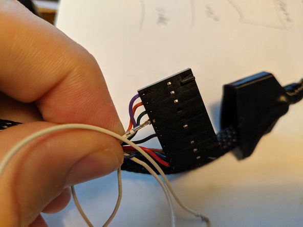 There are 2 empty spaces in the 10 pin plug next to each other between the green wire and the black wire.  This is where the thermistor wires will be plugged into.