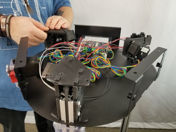 Lay the shim on the motor brackets and push them fully down lining up the tabs with the holes on the shim as shown in Pic 2.
