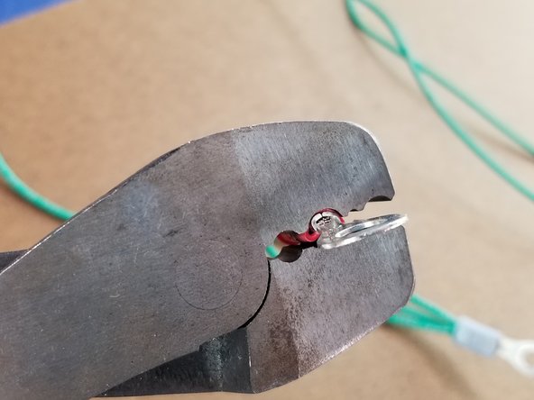 Attach the ring terminal as before to the end of one of the short green wires.  The wires should all be stripped as well to attach the crimp to bare wire.