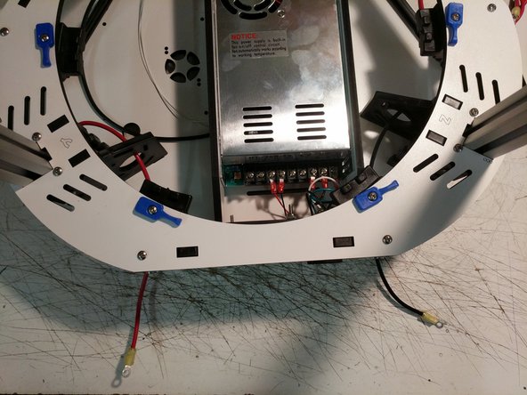 Crimp a yellow ring terminal onto both the black and red wires on the ends that exit the  bottom of the Y and Z towers.