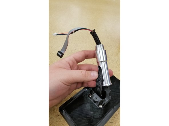 CAUTION: This is a tight fit, so it will require some force to install by design, but be very careful not to pinch the ribbon cables to the point of breaking or stripping on the edges of the post.