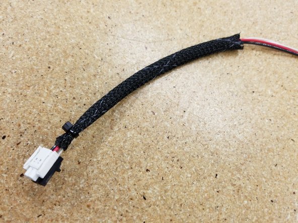 Pass the cables through the mesh loom, zip-tie them secure, and install the cable boot as we did in Step 3.