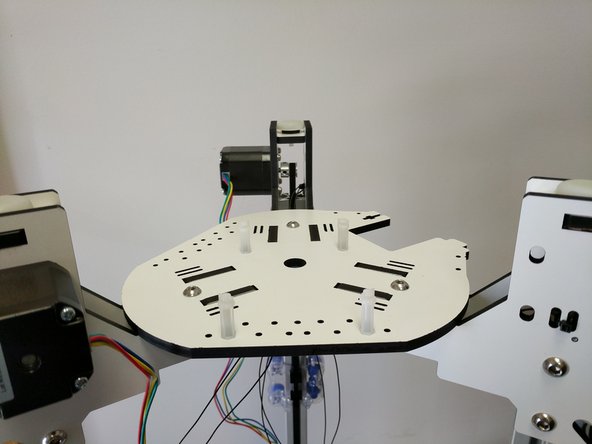 In this step and all other steps using the TSLOT nuts, the boss (ridge) on the nut should be facing away from the head of the button head screw.